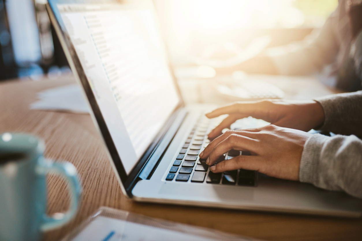 female typing on computer